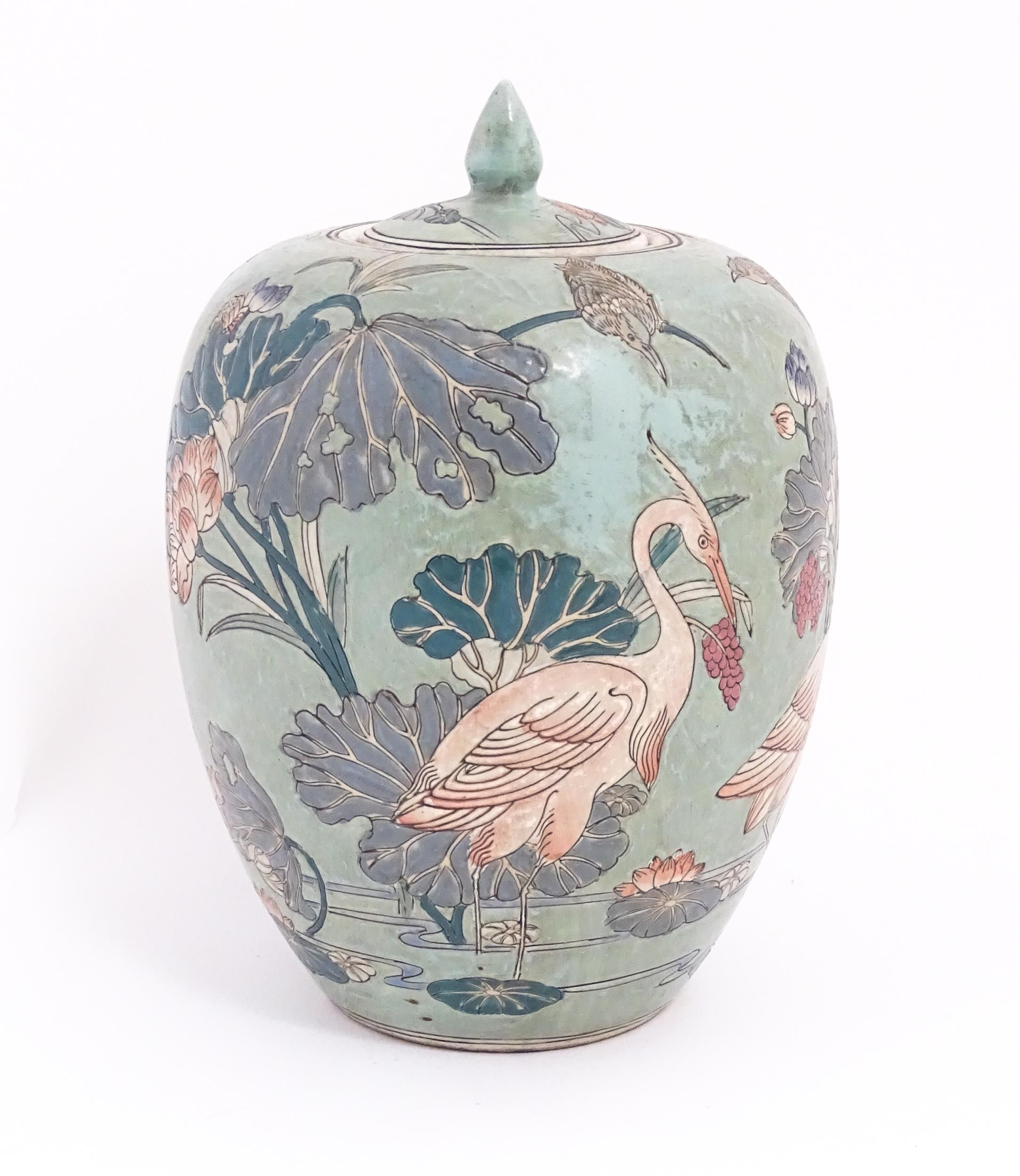 A Chinese ginger jar with celadon style glaze decorated with crane birds, flowers, lily pads, etc. - Image 4 of 8