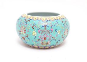 A Chinese planter of bulbous form, the turquoise ground decorated in the famille rose palette