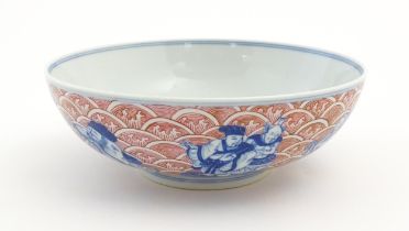 A Chinese blue, white and pink bowl the exterior decorated with the Eight Immortals upon their