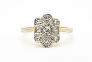 An Art Deco 18ct gold ring with nine platinum set diamonds. Ring size approx. M 1/2 Please Note - we