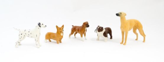 Five Beswick models of dogs comprising Corgi no. 1736, Whippet no. 1786B, Dalmatian no. 961, Bulldog