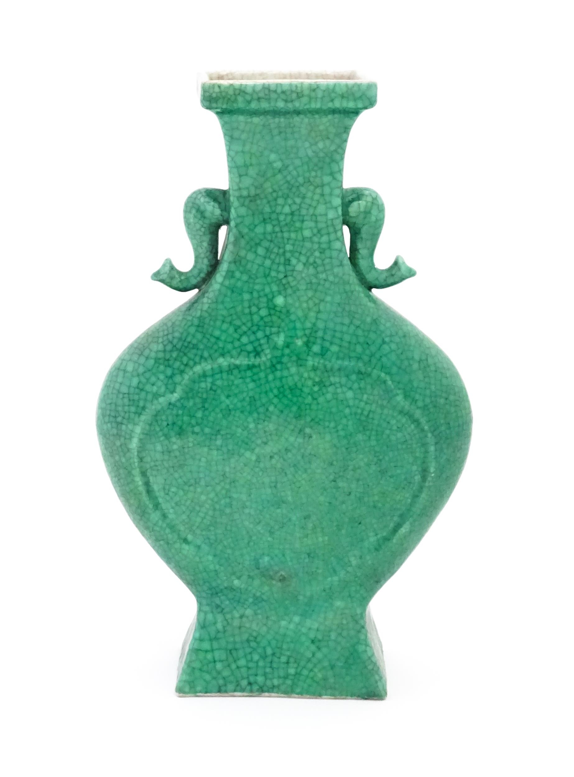 A Chinese vase of shaped form with twin elephant head handles with a green crackle glaze. Approx. - Image 5 of 6