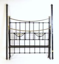 A 19thC painted iron bed with gilt highlights. Measuring 54" wide x 57" high x 74" long Please