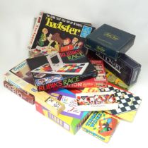A box of assorted board games etc. to include Monopoly, Taboo, Othello, Rubik's Race, Connect 4,