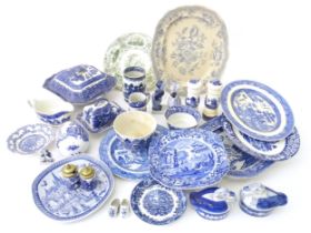 A quantity of assorted blue and white ceramics to include serving dishes, butter dish, jug, sauce