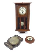 An early to mid 20thC oak cased wall clock, together with two barometers. The largest approx 28"