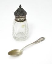 A Victorian cut glass pepper with silver top hallmarked London 1876. Together with a German .800