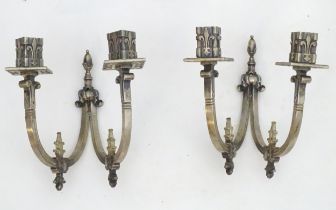 A pair of 20thC twin branch wall lights with Fleur de lys and stylised Georgian dolphin decoration