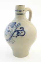 A Continental stoneware vase / jug with bulbous body and single handle, decorated with stylised
