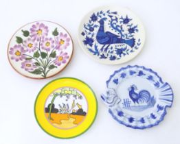 A quantity of plates to include a Wedgwood limited edition plate in the Tulip pattern designed by