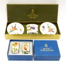 Four items of Royal Worcester in the Evesham pattern to include a pair of napkin rings, two pin