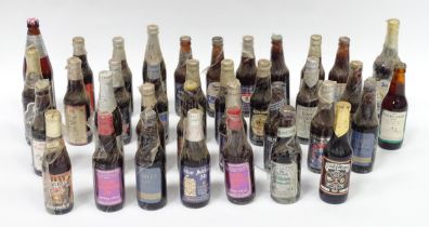 A quantity of late 20thC commemorative bottles of beer / ale / bitter / lager , including brews by