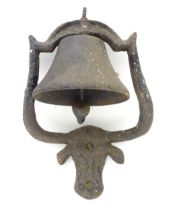 A 20thC cast iron farmhouse doorbell, the mount formed as a bull's head with elongated horns