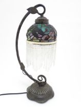 A Tiffany style table lamp with dragon fly detail to shade. The whole approx 19" high Please