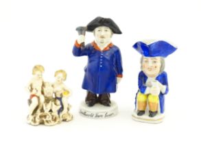 Three assorted ceramic figures to include a Toby / character jug modelled as a seated man wearing