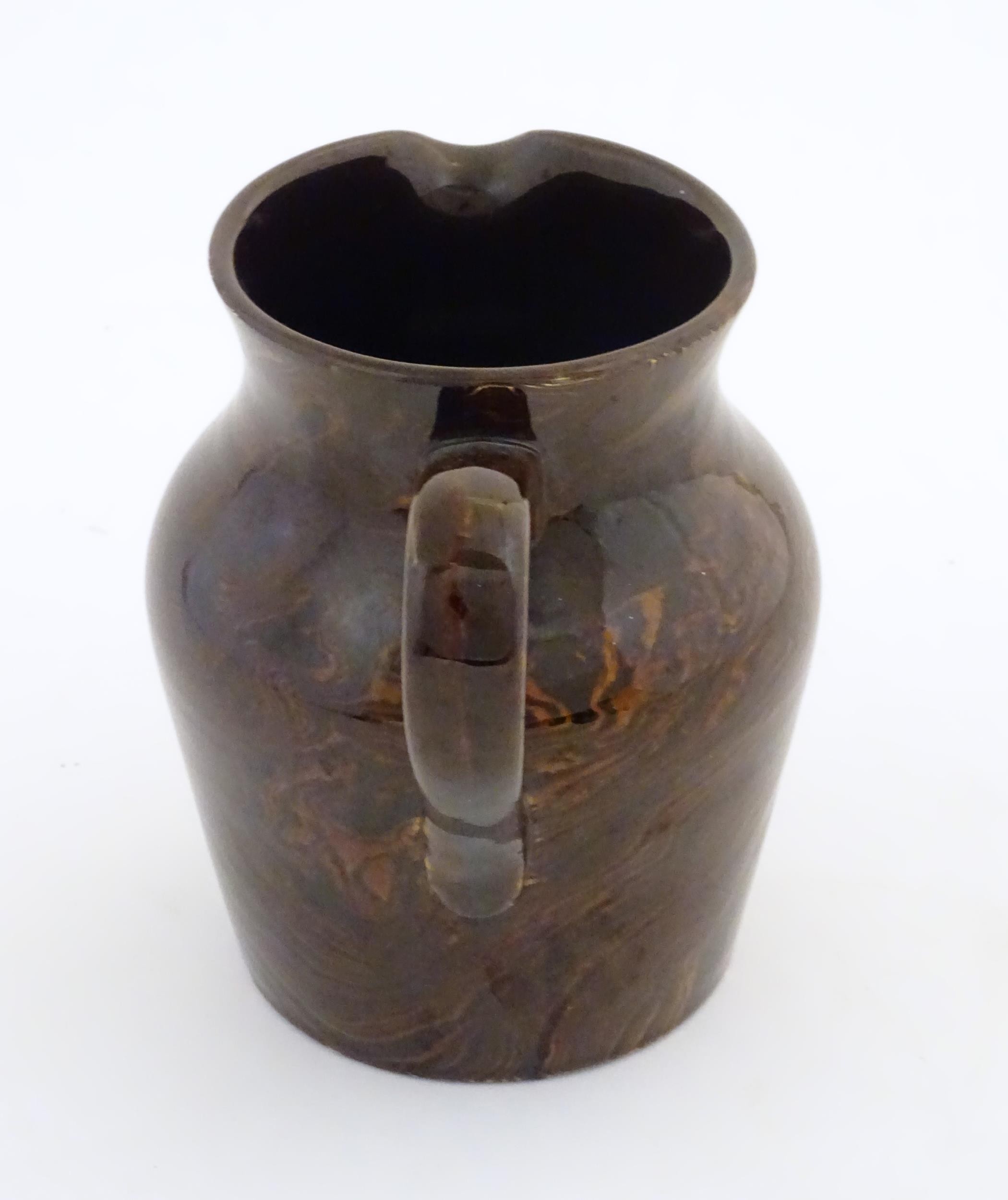 An agate wear jug with loop handle. Approx. 4 1/2" high Please Note - we do not make reference to - Image 4 of 7