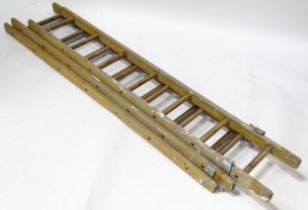 A wooden extending ladder. Extending to approx 18ft Please Note - we do not make reference to the