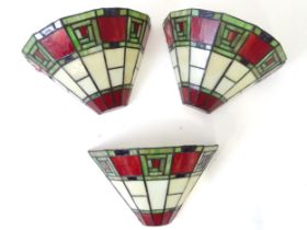 Three Tiffany style wall light shades, each approx 8" tall, 11 1/2" wide Please Note - we do not