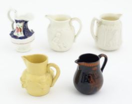 Five assorted Victorian and later miniature jugs to include a hand painted example with floral