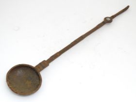 A blacksmith made wrought ladle / long handled spoon with incised and punch detail. Approx 35"