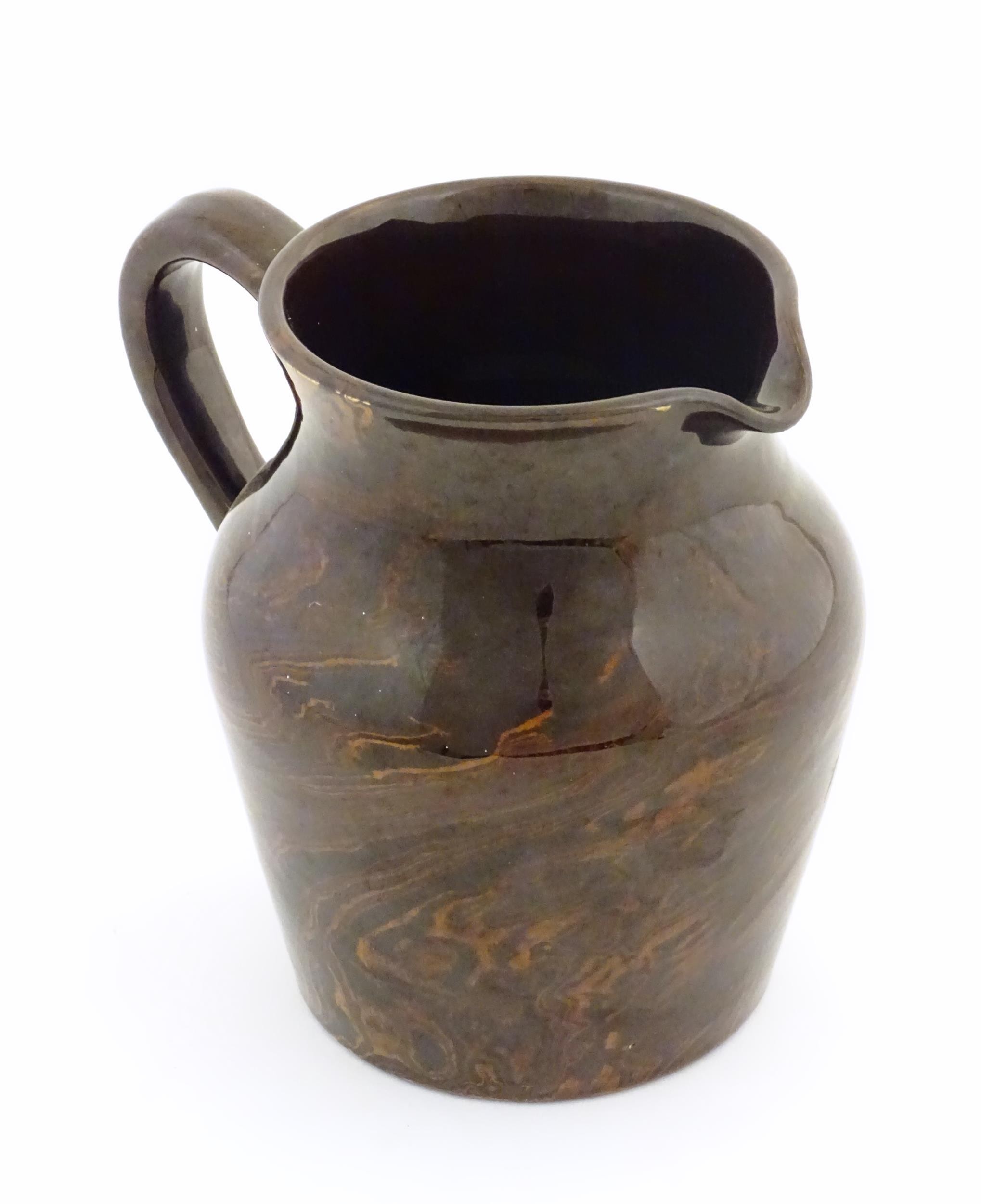 An agate wear jug with loop handle. Approx. 4 1/2" high Please Note - we do not make reference to - Image 7 of 7