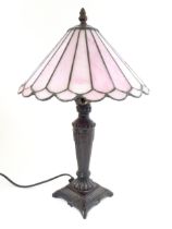 A Tiffany style table lamp with pink leaded glass shade. the whole approx 17" high Please Note -