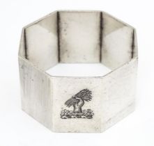 A silver napkin ring of octagonal form Please Note - we do not make reference to the condition of