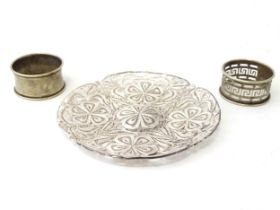 A silver filigree dish. Together with two silver plate napkin rings (3) Please Note - we do not make