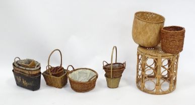 A bamboo and rattan circular table together with a collection of wicker baskets, etc. Please