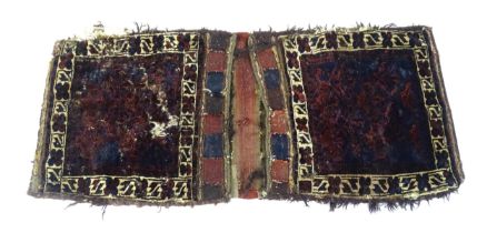 Rug : A woollen saddle bag style rug. Approx. 46" x 22" Please Note - we do not make reference to