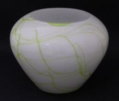 A glass vase with green marbled detail. Approx. 7 1/2" high Please Note - we do not make reference