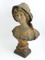 After Richard Aurili (1834-1914), An Italian plaster bust depicting a young lady wearing a hat, with