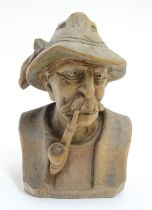A Continental carved model of a Tyrolean gentleman smoking a pipe. Approx 4 3/4'' high Please Note -