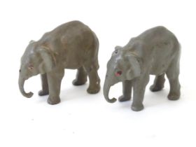 Toys: A pair of Britains models of elephants. Approx 2" long, 1 3/4" tall (2) Please Note - we do