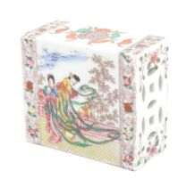 A Chinese pillow / flower brick decorated with female figures in a garden terrace, bordered by