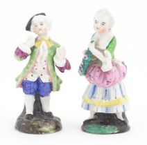 Two Continental ceramic figures, depicting a Regency gentleman and a young lady. One indistinctly