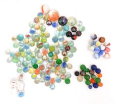 Toys: A quantity of assorted glass marbles, many with colours twists. Largest approx. 1" diameter