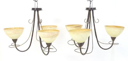 A pair of 3 branch lights with scroll detail and shades. Approx. 16 1/2" high overall (2) Please