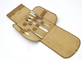 A quantity of early 20thC mother of pearl / mother of pearl handled tools to include button hooks,