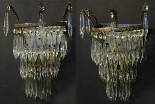 A pair of three tier wall lights with lustre drops and floral and foliate gilt metal detail. Approx.