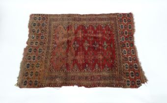 Carpet / Rug : A red ground rug with geometric motifs and banded borders, approx 60" x 43" Please
