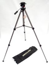 A cased telescoping and extending Vanguard camera / photography tripod, approx 52" high (expanded)