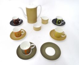 A quantity of assorted Susie Cooper coffee wares to include the Carnaby Daisy pattern, comprising