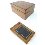 A Victorian walnut writing slope , the lid opening to reveal an inset leather panel and storage