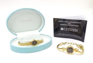 A cased Accurist ladies' dress watch, together with a Citizen ladies' dress watch with manual. (2)