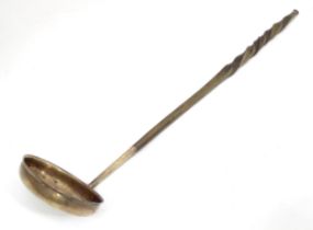 A 19thC toddy ladle with white metal bowl. Approx 14" long Please Note - we do not make reference to