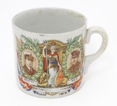 Militaria: an early 20thC ceramic mug with First World War / WWI / World War 1 commemorative