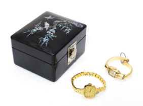 A black lacquer box with abalone shell decoration, together with two ladies wristwatches, one by