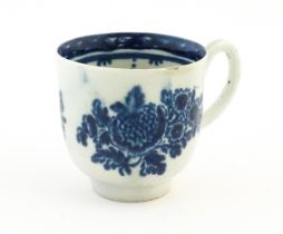 A John Pennington Liverpool blue and white coffee cup decorated in the Peony and Daisy pattern