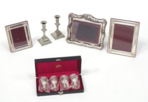 A quantity of Silver plate and white metal items to include photo frames, candlesticks etc. The